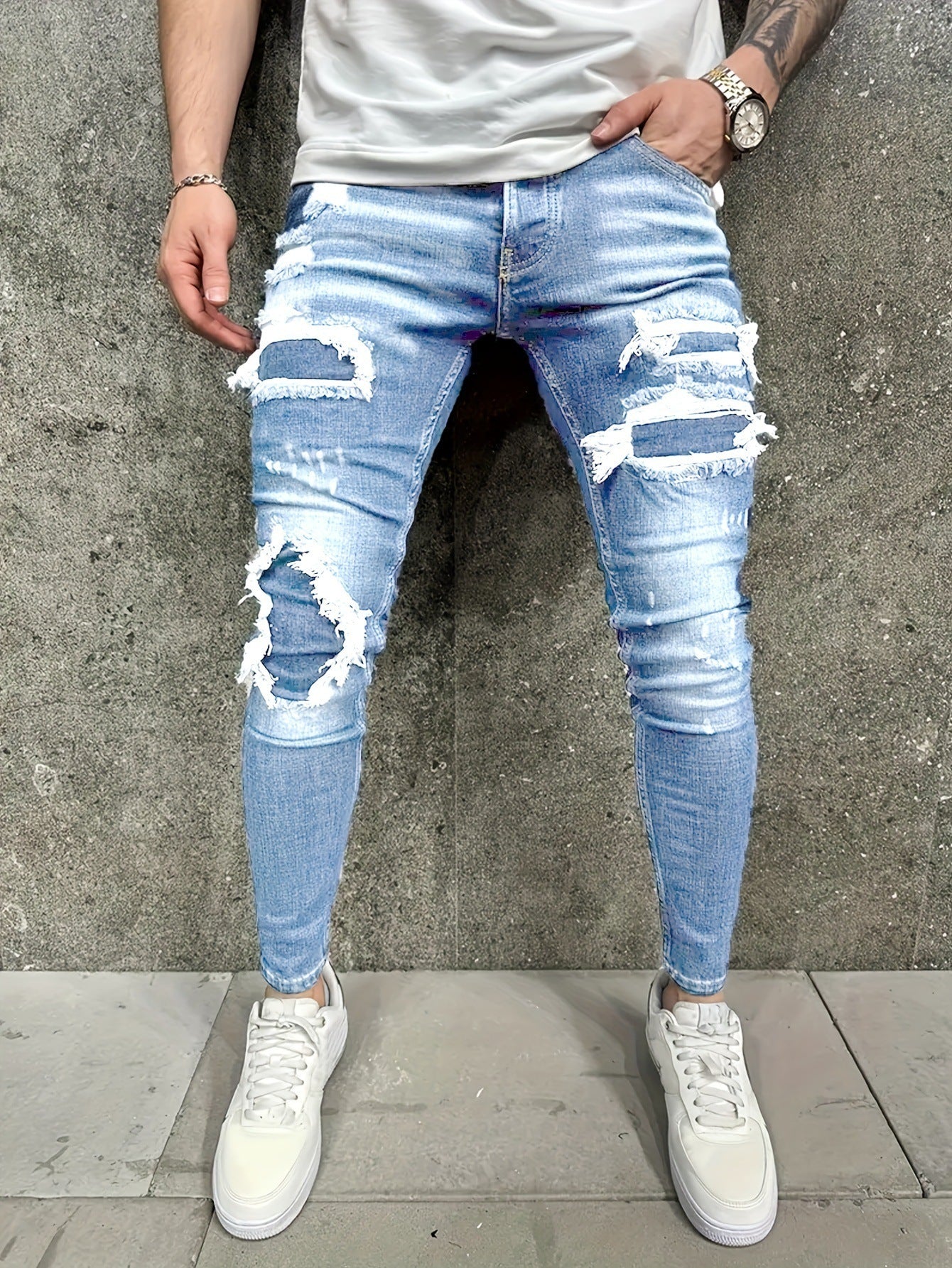 Jeans de hombre con parche desgastado